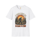 Bigfoot dad t-shirt design featuring a Sasquatch silhouette in a forest and mountain scene with the phrase “A Dad Like Me Is Hard To Find.”