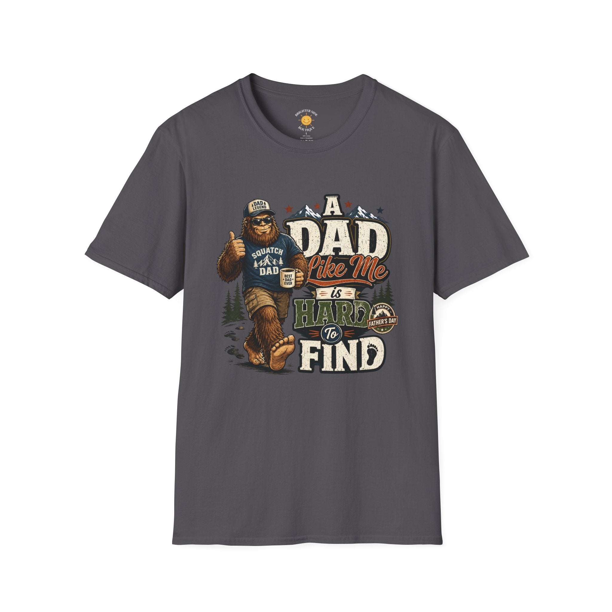 Bigfoot dad t-shirt design featuring a Sasquatch giving a thumbs up wearing is "Squatch Gear" in front of mountains with the phrase "A Dad Like Me Is Hard To Find."