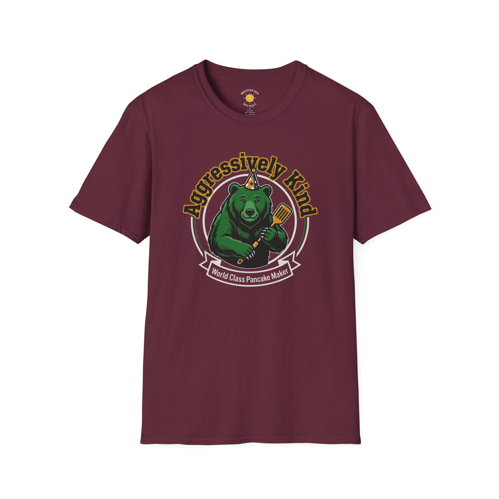 Vintage-style graphic featuring a happy green bear wearing a party hat and holding a spatula with the phrases "Aggressively Kind" and "World Class Pancake Maker."