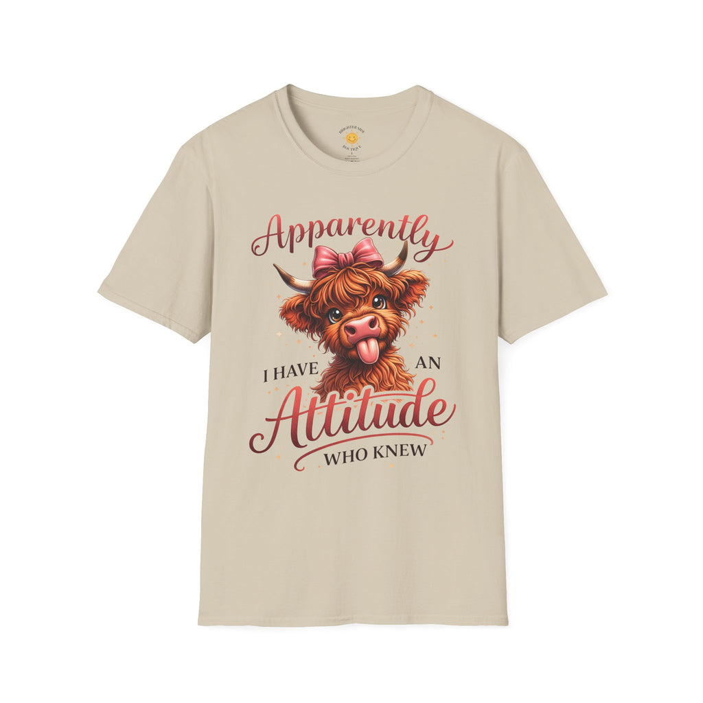 Cute Highland cow with pink bow sticking out its tongue and the phrase "Apparently I Have An Attitude Who Knew" in decorative script lettering.