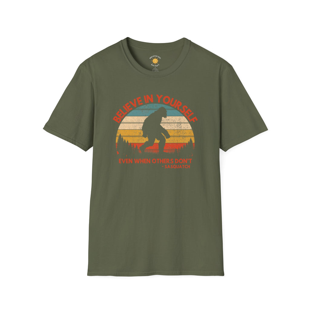Vintage sunset Bigfoot silhouette design with the quote "Believe In Yourself Even When Others Don't - Sasquatch" surrounded by forest scenery.