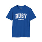 Bold varsity typography design featuring the phrase "Busy Doing Nothing" in white collegiate-style lettering on a dark background.