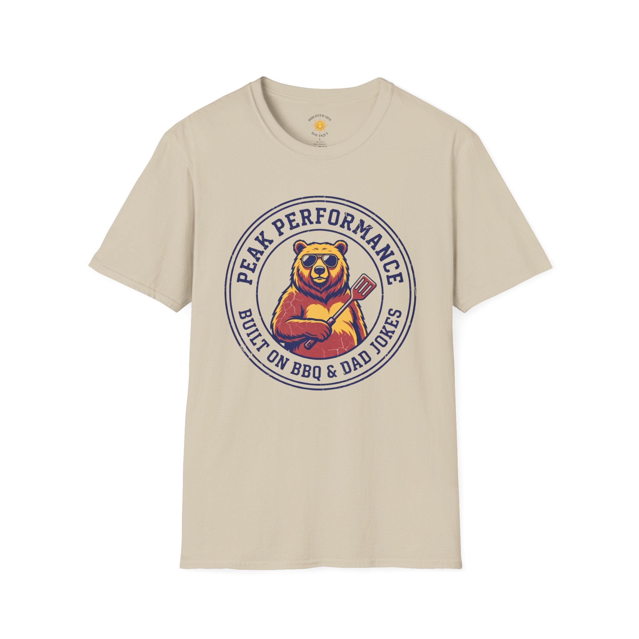 Vintage-style bear wearing sunglasses and holding a grill spatula with the phrase "Peak Performance Built On BBQ & Dad Jokes."